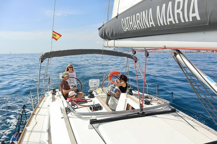 Barcelona: Coastline Boat Trip with Snacks and Cava - What happens during the two-hour cruise