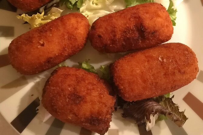Barcelona Food Tour: Tapas, Drinks and Delights with a Local - Carrer del Regomir, Cava, and familiar Spanish favorites