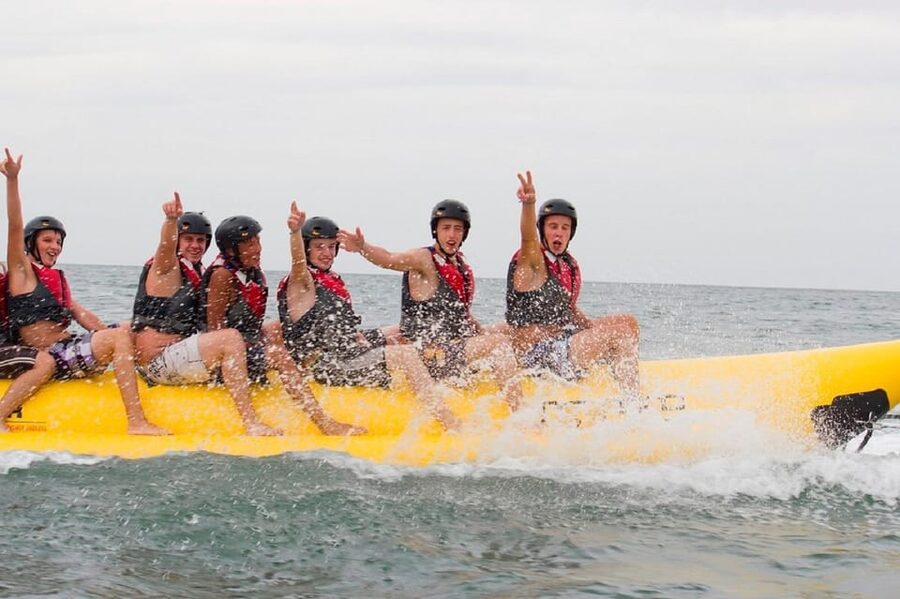 Barcelona: Inflatable Banana Boat Ride - Holding on for the ride