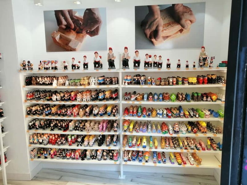Barcelona: Markets Tour With Food and Wine Tasting Upgrade - The caganer shop and a very Catalan tradition
