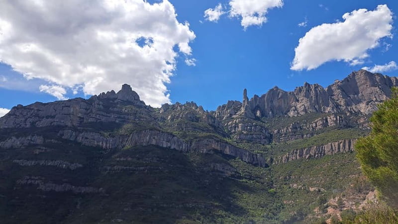 Barcelona: Montserrat Monastery and Natural Park Guided Tour - Entering the monastery founded in 1025
