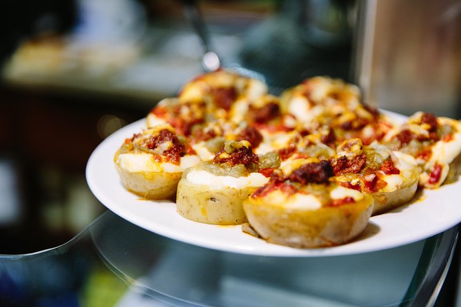 Barcelona Night Bike Tour with Local Tapas and Cava Stop - From Port Vell to the Columbus Monument