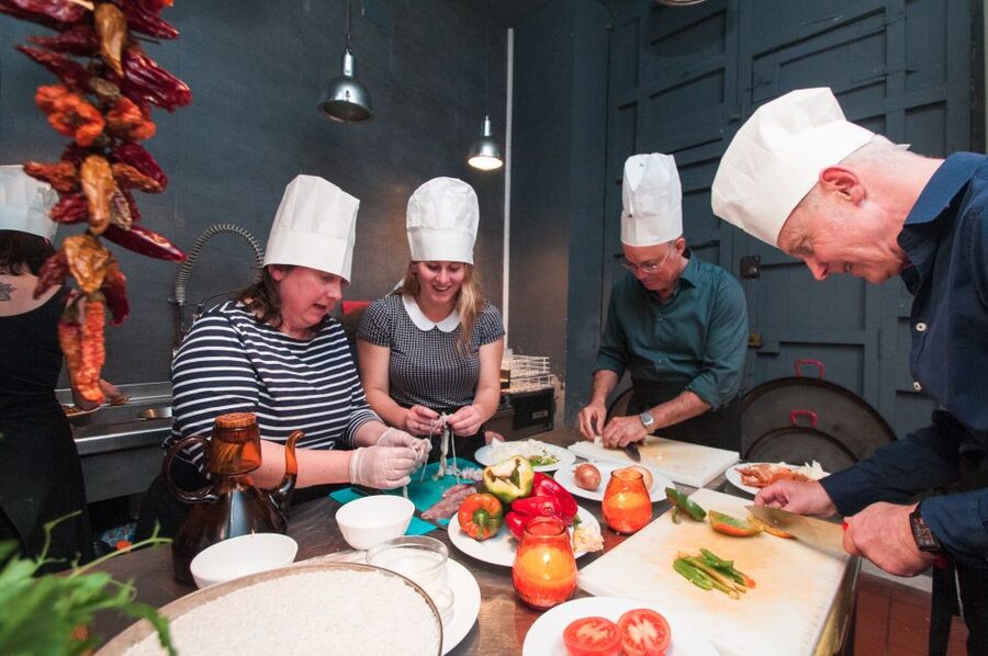 Barcelona: Paella Cooking Experience & Boqueria Market Tour - Watching seafood paella take shape