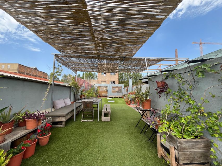 Barcelona: Rooftop Paella Cooking Class with Sangria - Sitting down to eat your own work