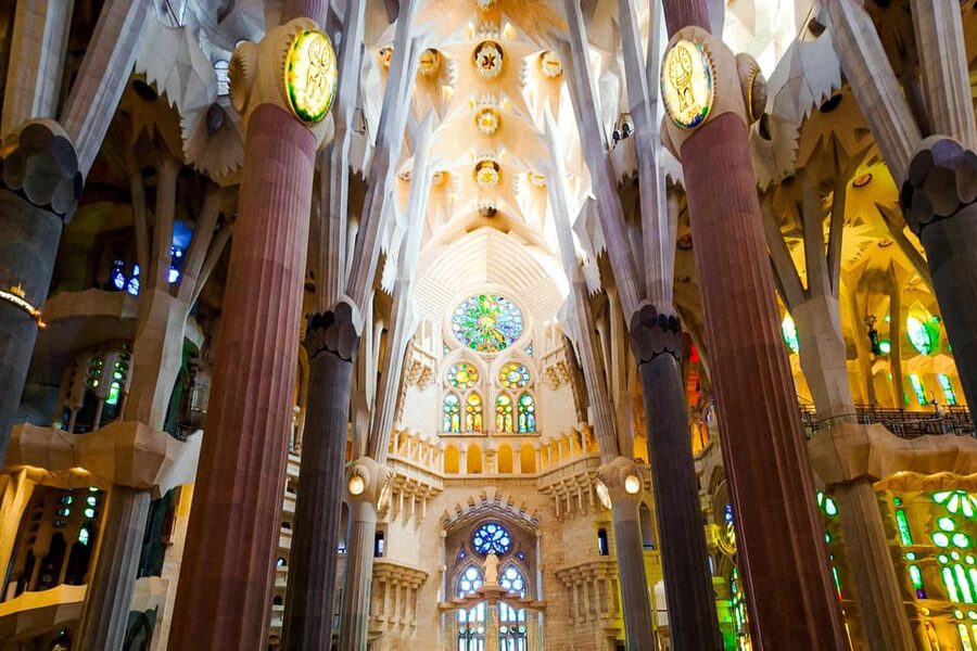 Barcelona: Sagrada Familia Priority Access Guided Tour - Entering the basilica beneath colored light