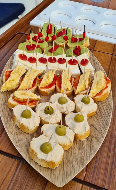Barcelona: Sailing Tour with Spanish Tapas and Drinks - Setting sail from Port Olímpic