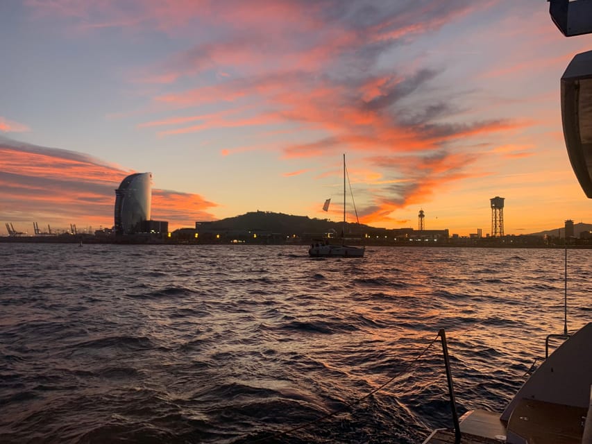 Barcelona: Shared cruise on luxury catamaran Drinks + Snacks - Tibidabo and the hills behind Barcelona