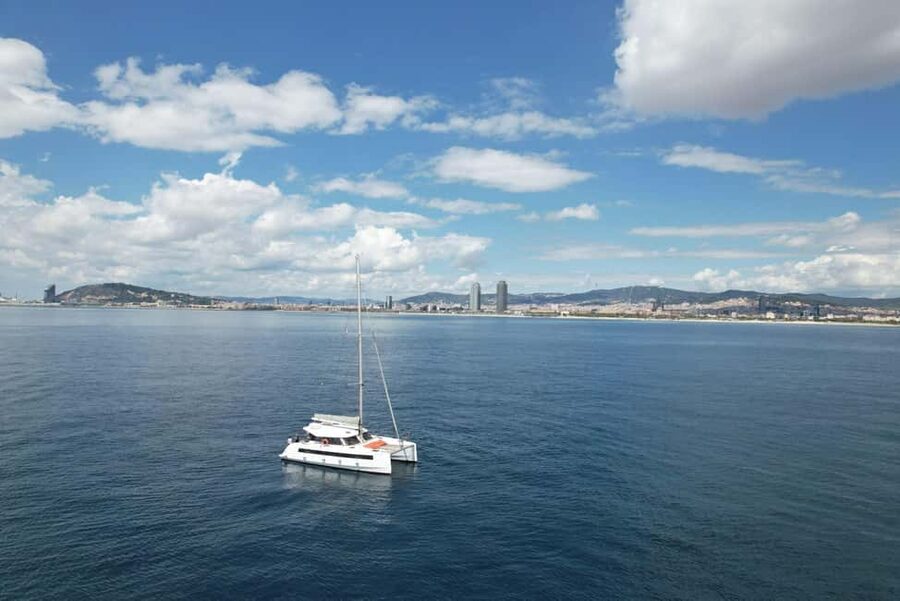 Barcelona: Shared cruise on luxury catamaran Drinks + Snacks - La Barceloneta from the water