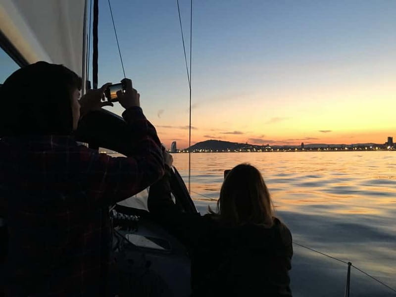 Barcelona: Sunset Boat Trip with Cava Wine and Snacks - Swimming and Trying the Helm