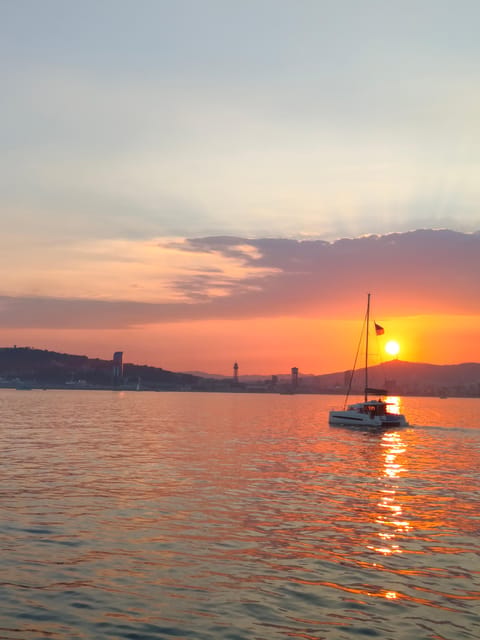 Barcelona: Sunset Cruise with Snacks and Drinks - Sunset timing and the evening view