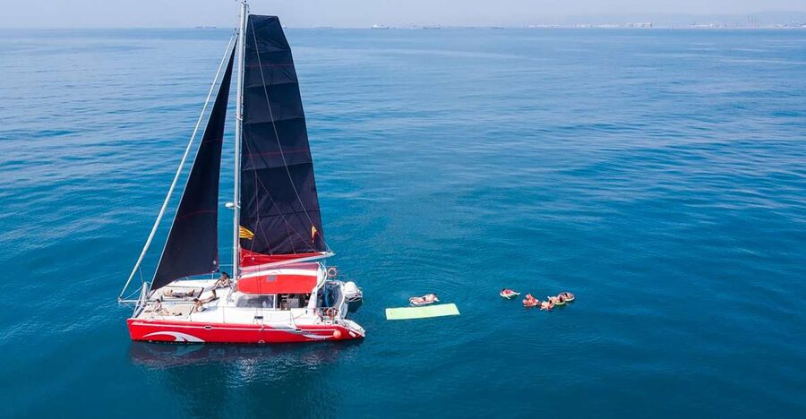 Barcelona: Sunset or Day Catamaran Cruise with Tapa & Drink - The first drink and small local tapa
