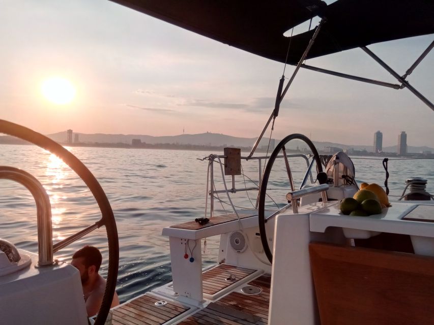 Barcelona: Sunset Sailing Tour with Open Bar & Snacks - Sunset behind the Barcelona hills