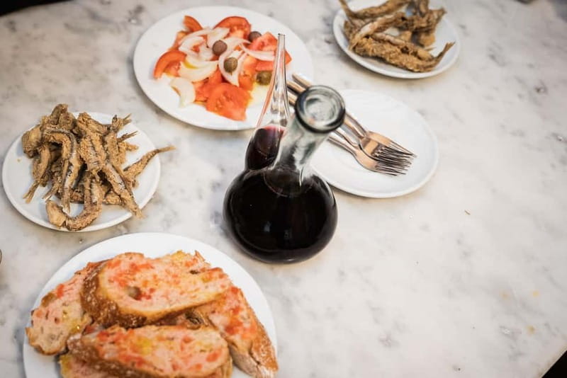Barcelona: The Ultimate Local Tapas & Drinks Food Tour - Stop three: charcuterie, montaditos, and lighter flavors