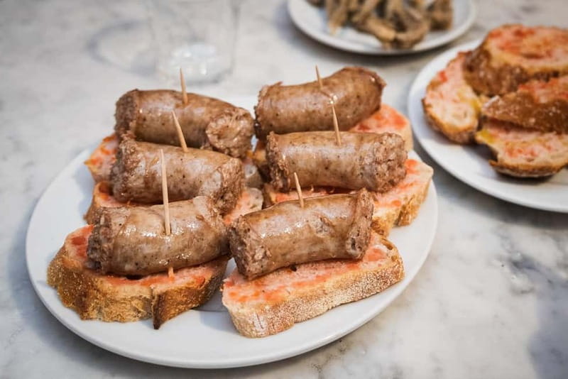 Barcelona: The Ultimate Local Tapas & Drinks Food Tour - Walking the Gothic Quarter between bites