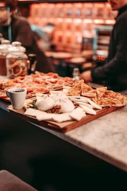 Barcelona: Tipsy Tapas & History Tour in the Gothic Quarter - Stop One: A Cozy Bar And Two Spanish Classics