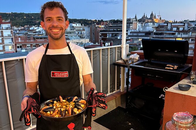 BBQ Paella in a Penthouse Terrace in Barcelona with a Chef - Sharing the paella around the terrace table