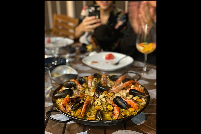 BBQ Paella in a Penthouse Terrace in Barcelona with a Chef - Clericot and the included drinks