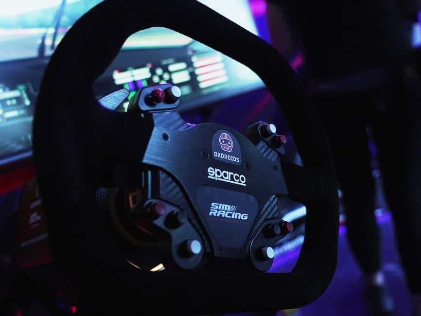 Casino Barcelona – Car Racing Simulator + Welcome Drink - Getting strapped into the IMSIM Alma simulator