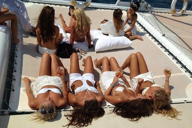 Catamaran trip with other groups along the Costa Brava. Saturday. - A shared party boat, not a private cruise