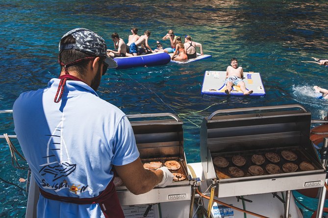 Catamaran trip with other groups along the Costa Brava. Saturday. - Barbecue lunch cooked on board
