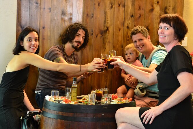 Food and Market Tapas Tour - Sharing wine at La Taverna del Coure