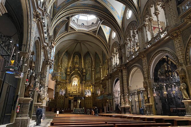 Historical Montserrat Half-Day Hiking Tour from Barcelona - Riding the Sant Joan funicular uphill