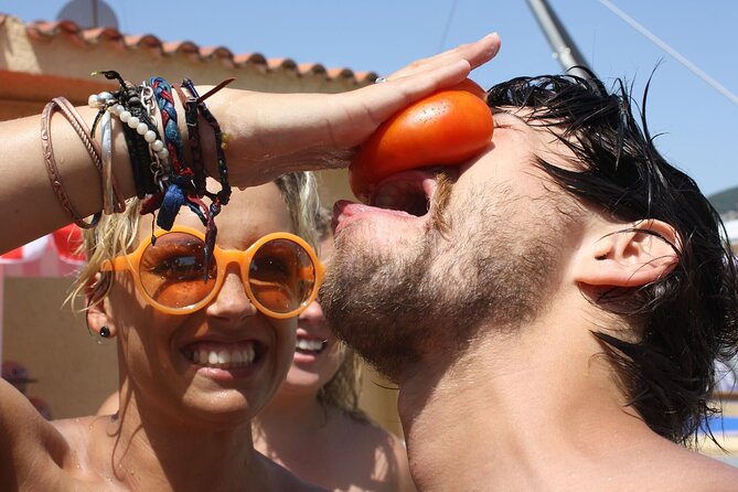 La Tomatina Day Trip from Barcelona with Ticket & Party Access - From tomato chaos to Valencia’s beach