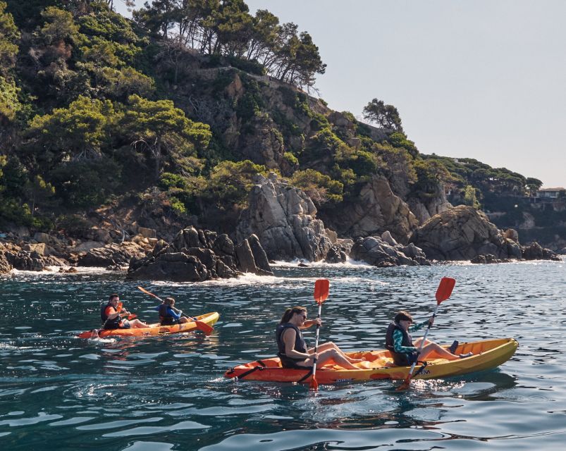 Lloret de Mar: Costa Brava Kayak Tour and Swimming - The halfway swim in a rocky cove