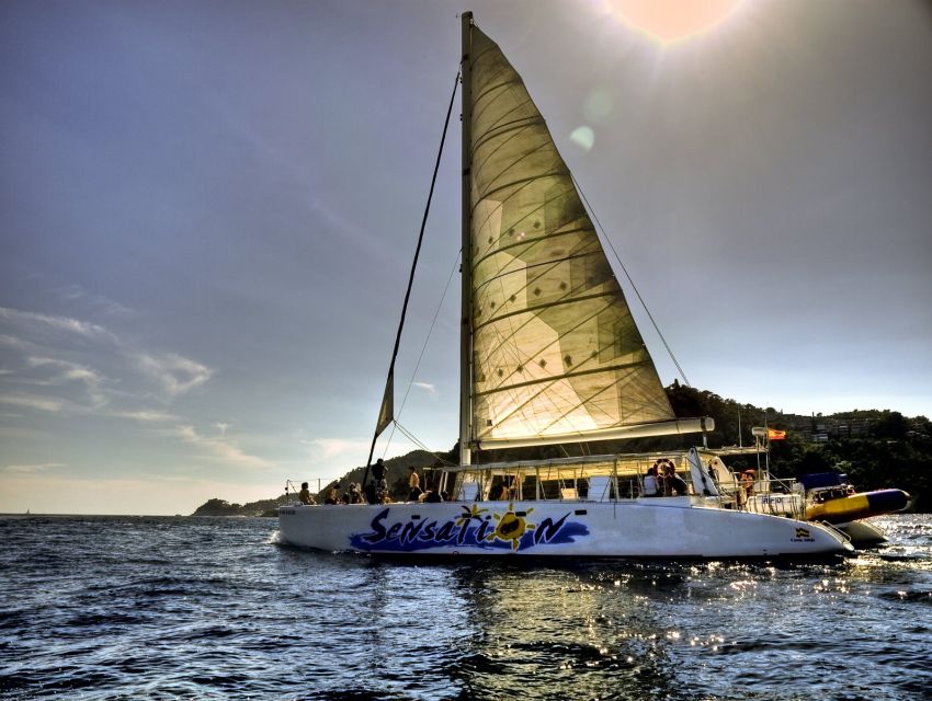 Lloret de Mar: Sunset Catamaran Cruise with DJ and Drinks - Meeting at Passeig dAgustí Font
