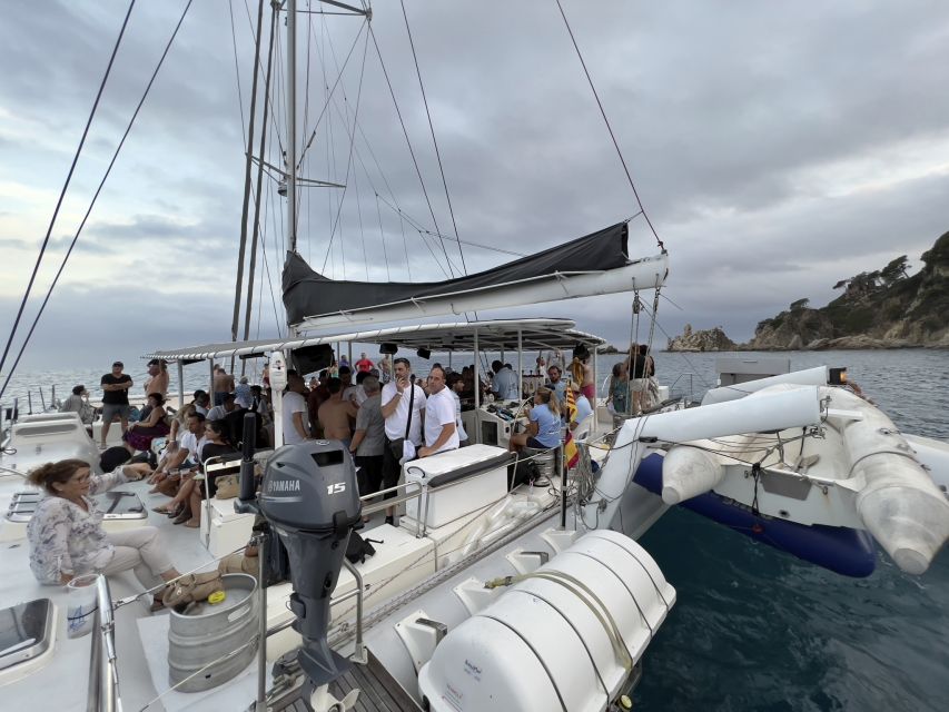 Lloret de Mar: Sunset Catamaran Cruise with DJ and Drinks - The swimming stop in a quiet inlet