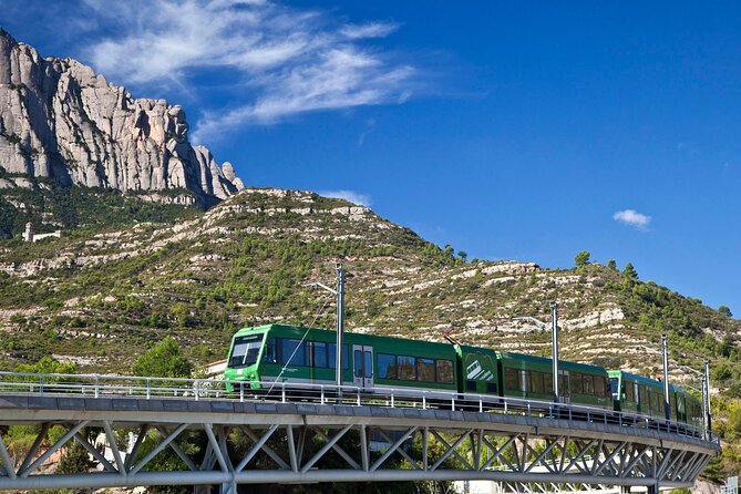 Montserrat Complete Guided Tour & The Boys Choir's Performance - Riding the Montserrat rack railway
