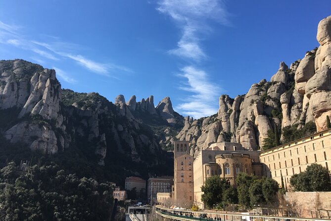 Montserrat Land of Shrines - One Day Small Group Hiking Tour from Barcelona - Riding the Sant Joan funicular uphill