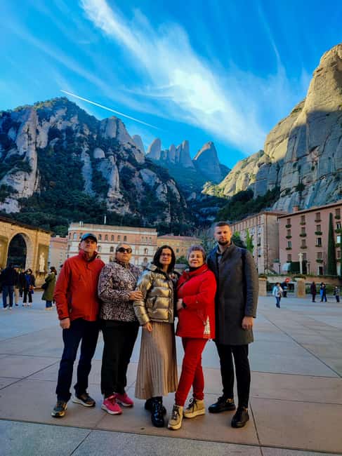 Montserrat Small Group Tour with Train and Cable Car - Walking through the monastery complex