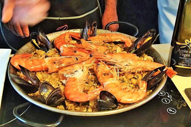 Premium Paella Cooking Class & 10 Spanish Tapas - The people make the class work