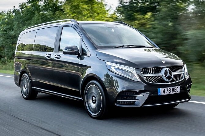 Private Barcelona Airport–City Transfer E-Class, V-Class, Minibus - Speaking with the driver about Barcelona
