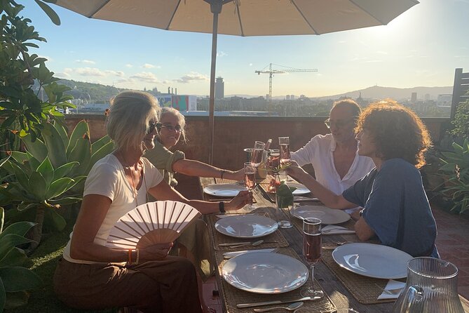 Rooftop Paella Seafood Cooking Class Experience in Barcelona - Dinner on the plant-filled rooftop