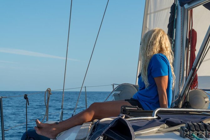 Sailing experience on a 4-hour sailboat in Girona - The cove stop: swimming, snorkeling, and paddleboarding
