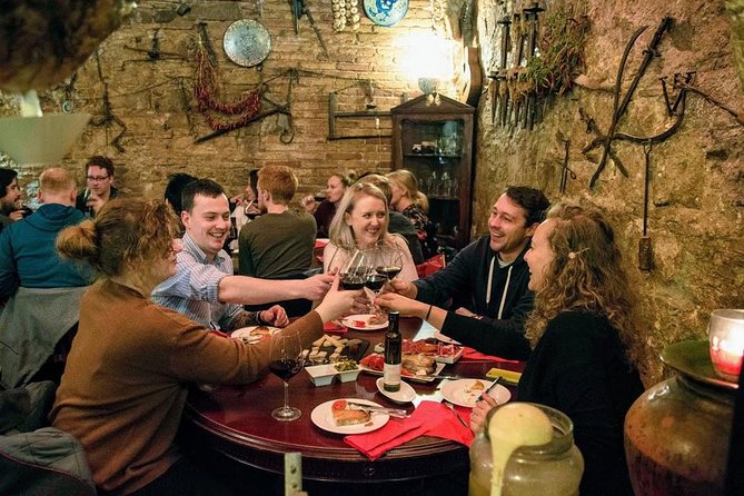 Savor Spain: Food, Wine, History & Culture Small Group Tour in Old Barcelona - La Rambla: meeting beneath Barcelona’s famous promenade